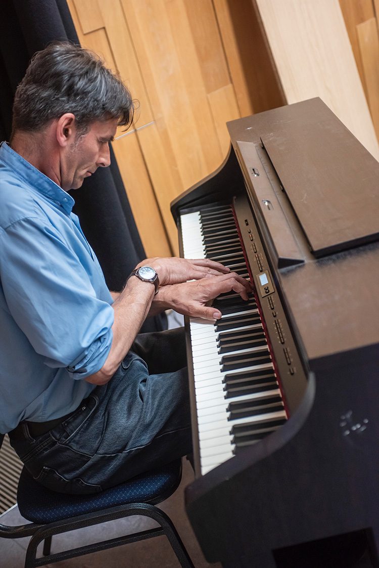 Piano keys, crossed hands, Grassmarket Community Project event with Ricky Ross