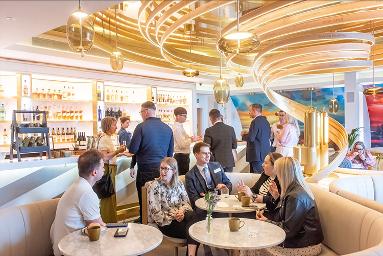 Edinburgh Camber of Commerce event at Johnnie Walker Edinburgh, Business meeting in Explorers Bothy, people with coffee, talking